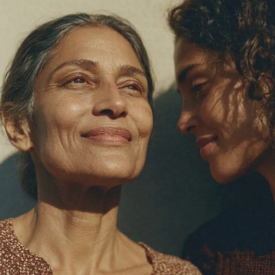 Older woman with another person in warm sunlight
