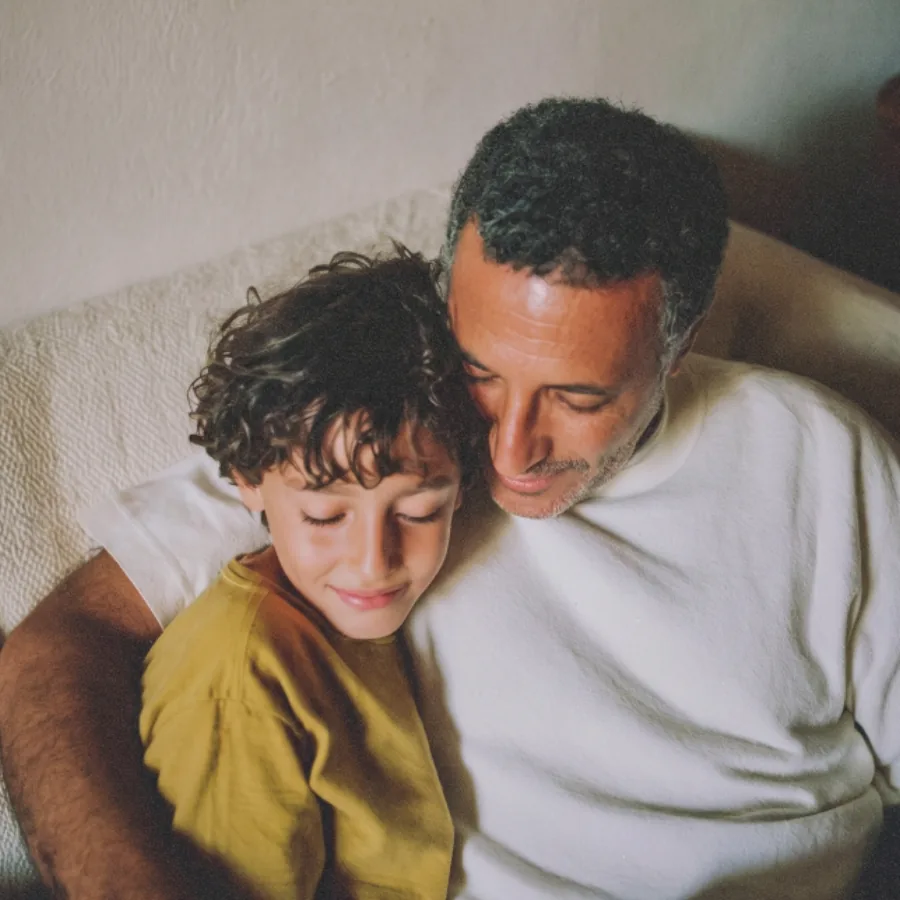 Parents sitting with a child at home
